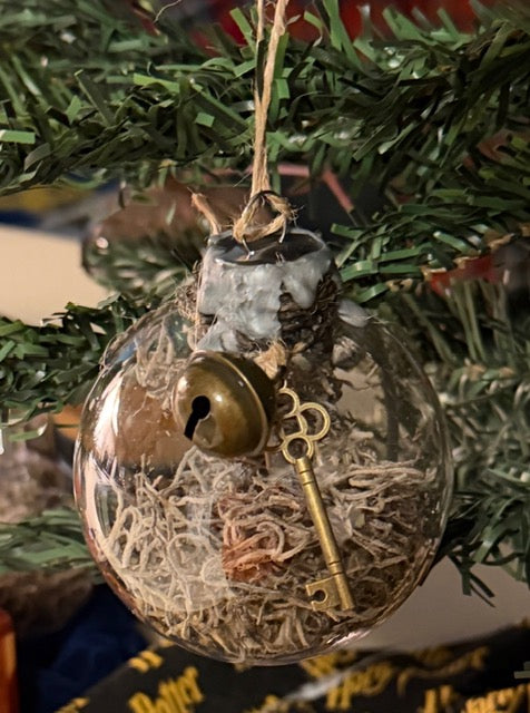 Handmade Protection Witch Ball with moss, sealing wax, bell, and key charms