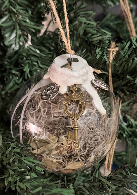 Handmade Cleansing Witch Ball with white wax, moss, key, and charms