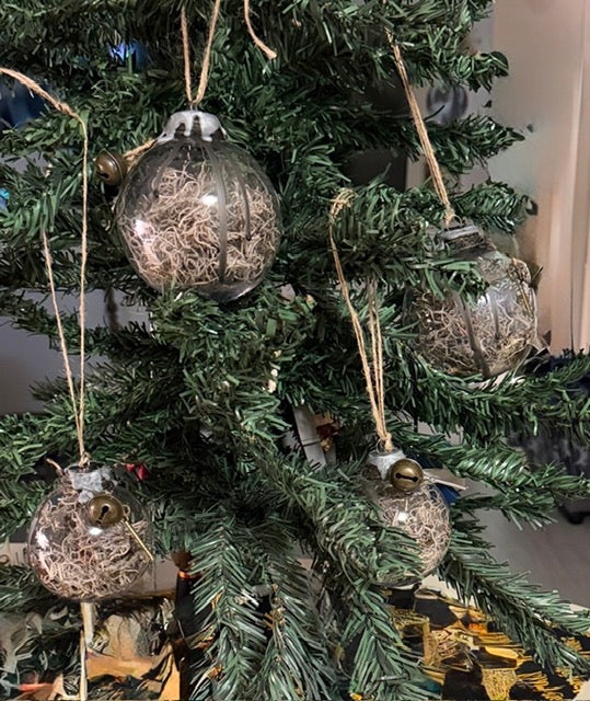 Handmade Protection Witch Balls hanging on a decorative tree